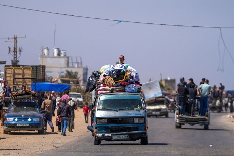 Displaced Palestinians arrive in central Gaza after fleeing from the southern Gaza city of Rafah in Deir al Balah, Gaza Strip, on Thursday, May 9, 2024.