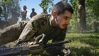 Newly recruited soldiers of the 3rd assault brigade train in Kyiv, Ukraine, Friday, May 17, 2024