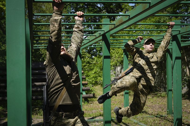 Newly recruited soldiers of the 3rd assault brigade train in Kyiv, Ukraine, Friday, May 17, 2024.