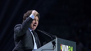 Argentina's president Javier Milei gestures as he delivers a speech on stage during the Spanish far-right wing party Vox's rally "Europa Viva 24" in Madrid, Spain, Sunday, May