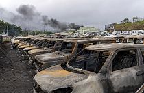 FILE - Burnt cars are lined up after unrest that erupted following protests over voting reforms in Noumea, New Caledonia, Wednesday, May 15, 2024.