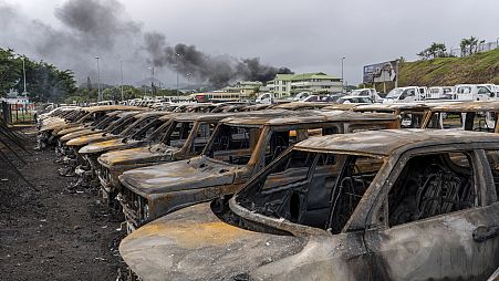FILE - Burnt cars are lined up after unrest that erupted following protests over voting reforms in Noumea, New Caledonia, Wednesday, May 15, 2024.