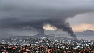  Smoke rises during protests in Noumea, New Caledonia, Wednesday May 15, 2024.