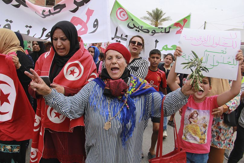 Tunisians participate in a protest against the presence of sub-Saharan migrants stranded in olive-growing towns on the Tunisian coastline, Jebeniana, Saturday, May 18, 2024.