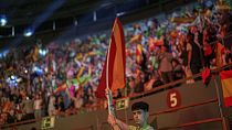A supporter holds a Spansh flag during the Spanish far-right wing party Vox's rally "Europa Viva 24" in Madrid, Spain, Sunday, May 19, 2024.