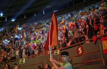 A supporter holds a Spansh flag during the Spanish far-right wing party Vox's rally "Europa Viva 24" in Madrid, Spain, Sunday, May 19, 2024.