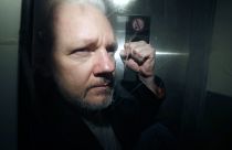 WikiLeaks founder Julian Assange being taken from court.