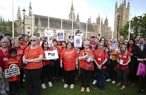 Infected blood campaigners gather in Parliament Square, ahead of the publication of the final report into the scandal, in London.