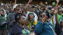 Supporters wait for former South African President Jacob Zuma to arrive at Orlando stadium in the township of Soweto.