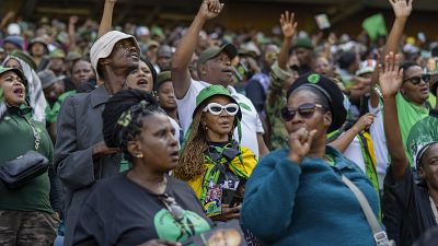 Supporters wait for former South African President Jacob Zuma to arrive at Orlando stadium in the township of Soweto.
