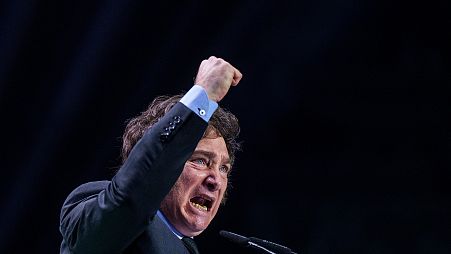 Argentina's president Javier Milei gestures as he delivers a speech on stage during the Spanish far-right wing party Vox's rally "Europa Viva 24" in Madrid, 19 May 2024
