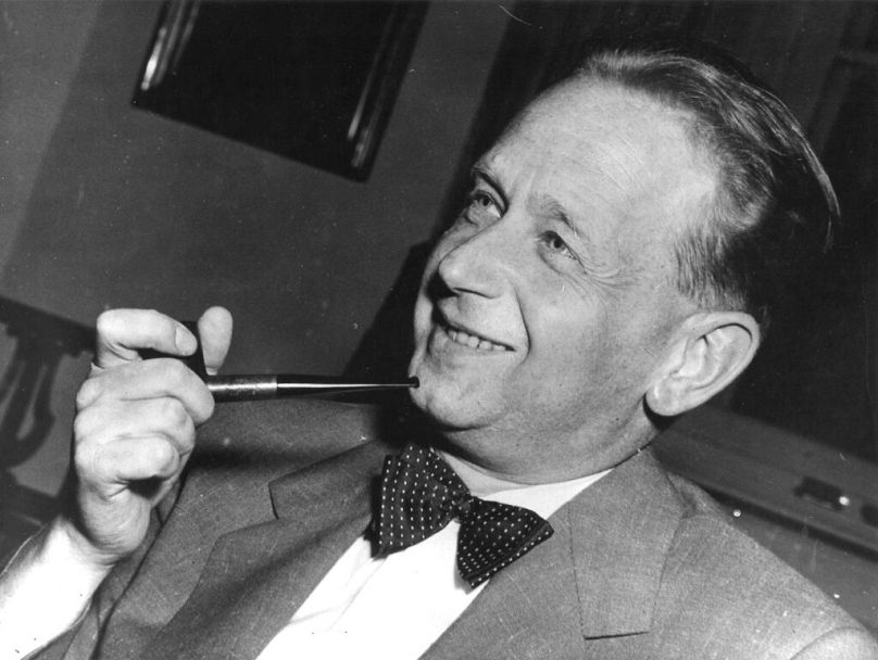 FILE - In this May 19, 1953, file photo, Dag Hammarskjold, recently appointed secretary general of the United Nations who is on a visit to Sweden, smokes his pipe.