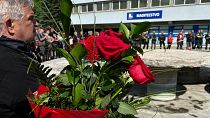 People bring flowers at the F.D Roosevelt hospital, in Banska Bystrica, Slovakia, on May 19, 2024, where Slovak PM Robert Fico is being treated