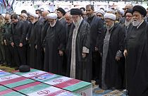 Supreme Leader Ayatollah Ali Khamenei leads a prayer over the flag-draped coffins of the late President Ebrahim Raisi and his companions who were killed in a helicopter crash
