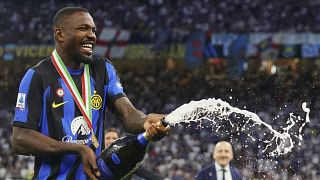Inter's Marcus Thuram celebrates their victory of the "scudetto" after the Serie A soccer match between Inter and Lazio at the San Siro Stadium in Milan on 19 May 2024