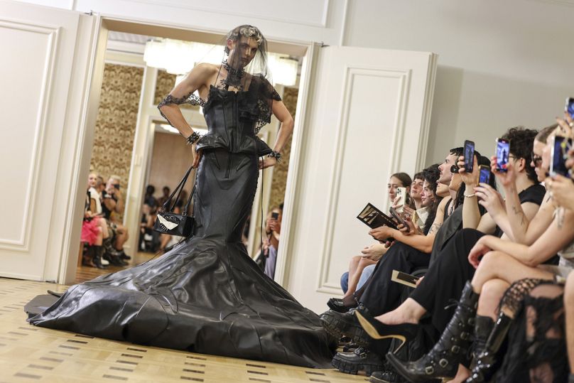 A model walks at the fashion show featuring recycled materials at Kronprinzenpalais during Berlin Fashion Week, July 2023