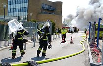 Firefighters work to extinguish a fire at the Novo Nordisk headquarters in Bagsvaerd, near Copenhagen, Denmark.