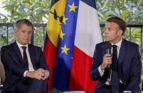 French President Emmanuel Macron sits next to France's Minister for Interior and Overseas Darmanin during a meeting with New Caledonia's elected officials, May 23, 2024.