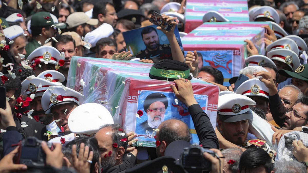 In this photo released by the Iranian Presidency Office, flag-draped coffins of the President Ebrahim Raisi and his companions who were killed in a helicopter crash on Sunday.
