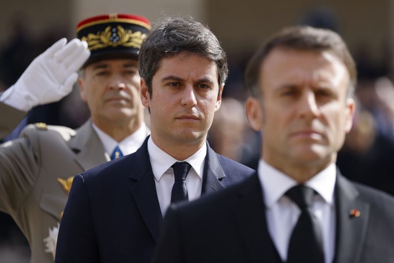 France's Prime Minister Gabriel Attal and France's President Emmanuel Macron attend a "national tribute" ceremony at the Hotel des Invalides in Paris, 20 March 2024