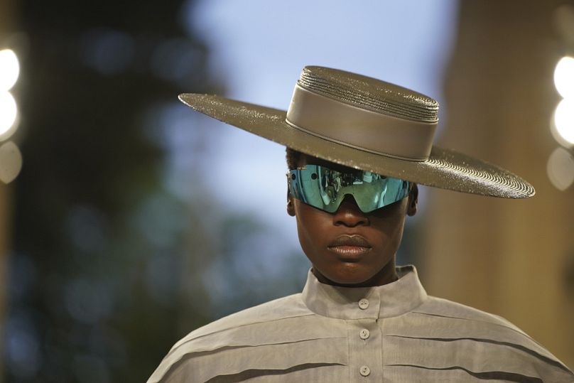 A model wears a creation by Louis Vuitton during a fashion show for the Cruise 2025 collection in the Park Guell in Barcelona, Spain, Thursday, 23 May 2024.
