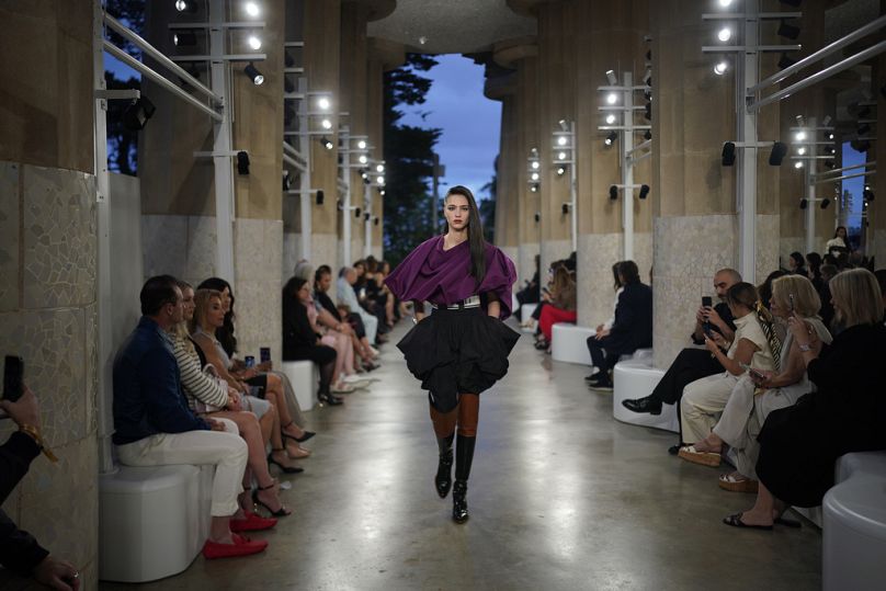 A model wears a creation by Louis Vuitton during a fashion show for the Cruise 2025 collection in the Park Guell in Barcelona, Spain, Thursday, May 23, 2024.