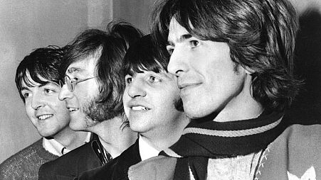 The Beatles in 1968, with George Harrison on the right.