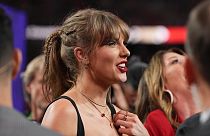 Taylor Swift watches the celebration on the field after the NFL Super Bowl 58 football game between the Kansas City Chiefs and the San Francisco 49ers. Feb. 11, 2024. 