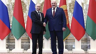Russian President Vladimir Putin, left, and Belarusian President Alexander Lukashenko shake hands during a welcome ceremony at the Palace of Independence in Minsk, Belarus.