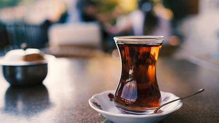 A cup of Turkish tea in a traditional ince belli (which literally translates to "slim-waisted") glass