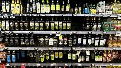 Olive oil bottles are seen in a supermarket in Rome, Friday, March 8, 2024.