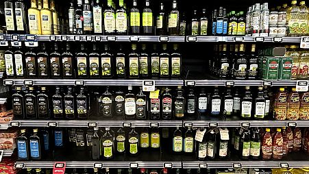 Olive oil bottles are seen in a supermarket in Rome, Friday, March 8, 2024.