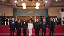 Director Michel Hazavanicius and leading crew of 'The Most Precious of Cargoes' line up at the Cannes premiere on May 24, 2024.