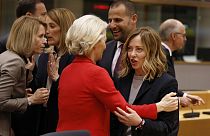 Italy's Prime Minister Giorgia Meloni, right, speaks with European Commission President Ursula von der Leyen during a round table meeting at an EU summit in Brussels.