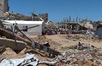 In the southern city of Khan Younis in the Gaza Strip, dozens of people attended Friday prayers near the destroyed Islam Mosque. 