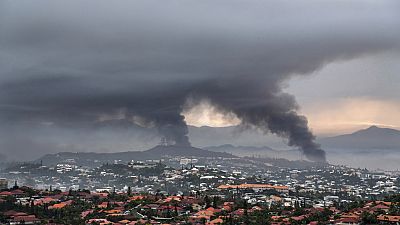 FILE - Smoke rises during protests in Noumea, New Caledonia, Wednesday May 15, 2024. France has imposed a state of emergency in the French Pacific territory of New Caledonia. 