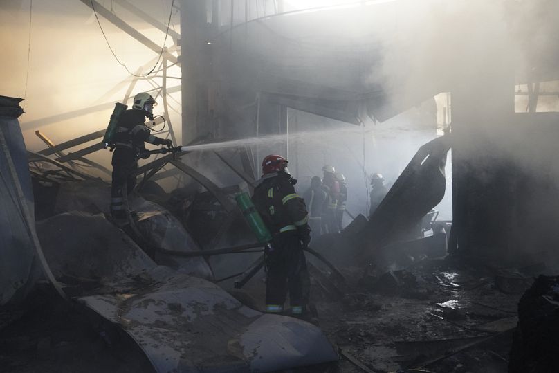 Firefighters put out a fire after Russian attack in Kharkiv, Ukraine