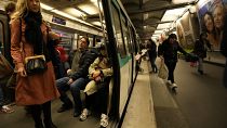 A passenger stands inside a metro train, at the Oberkampf district east of Paris, France, Thursday, Oct. 26, 2023. 
