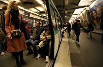 A passenger stands inside a metro train, at the Oberkampf district east of Paris, France, Thursday, Oct. 26, 2023. 