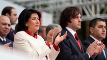 President Salome Zourabichvili, left, and Prime Minister Irakli Kobakhidze, right, attend a celebration for Independence Day in Tbilisi, May 26, 2024