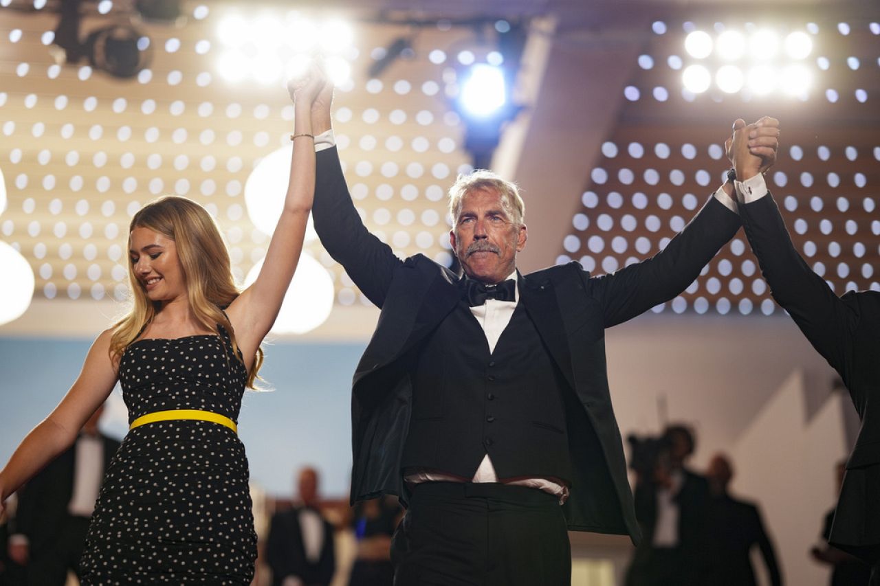 Georgia MacPhail and Kevin Costner pose at the 'Horizon: An American Saga' premiere during the 77th Cannes Film Festival in southern France on 19 May 2024.