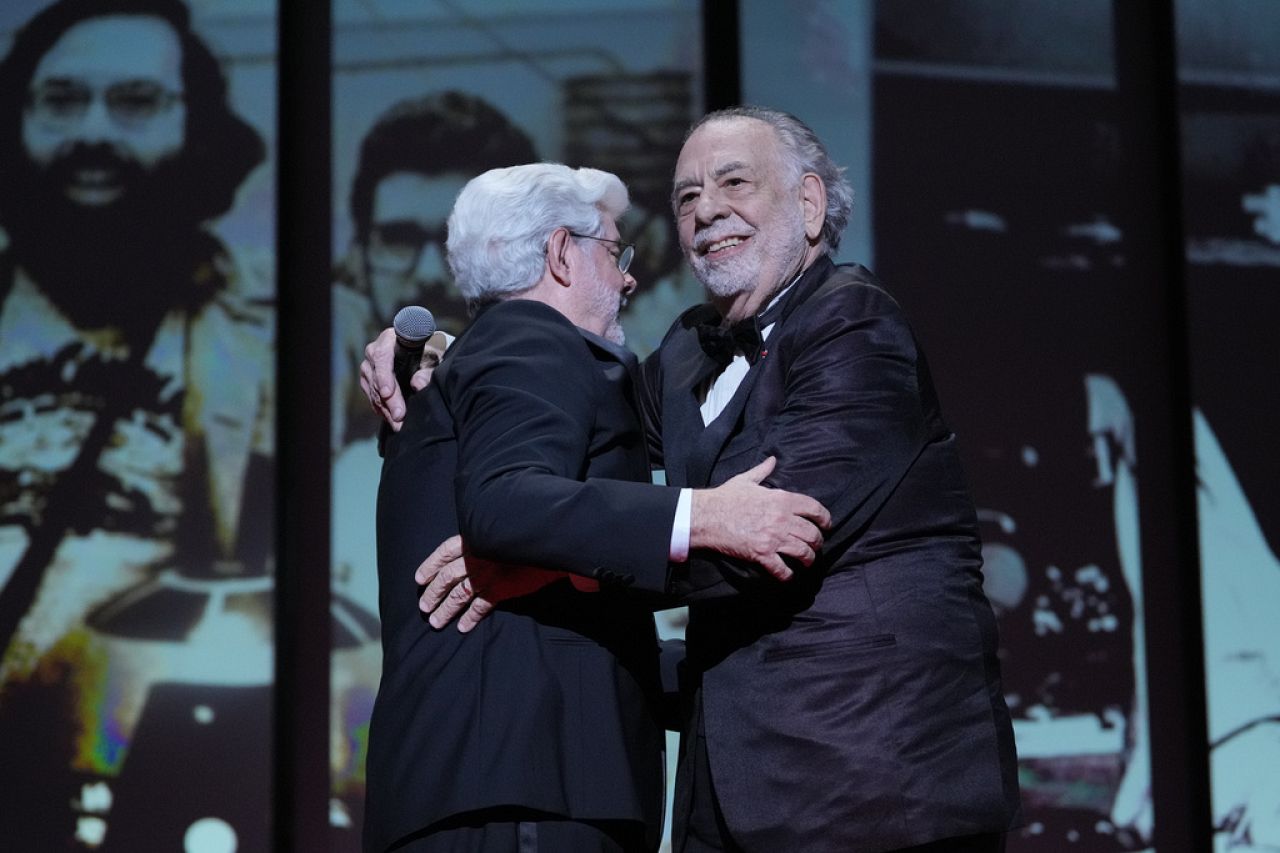 Francis Ford Coppola and George Lucas react during the awards ceremony at the 77th Cannes Film Festival in southern France on 25 May 2024.