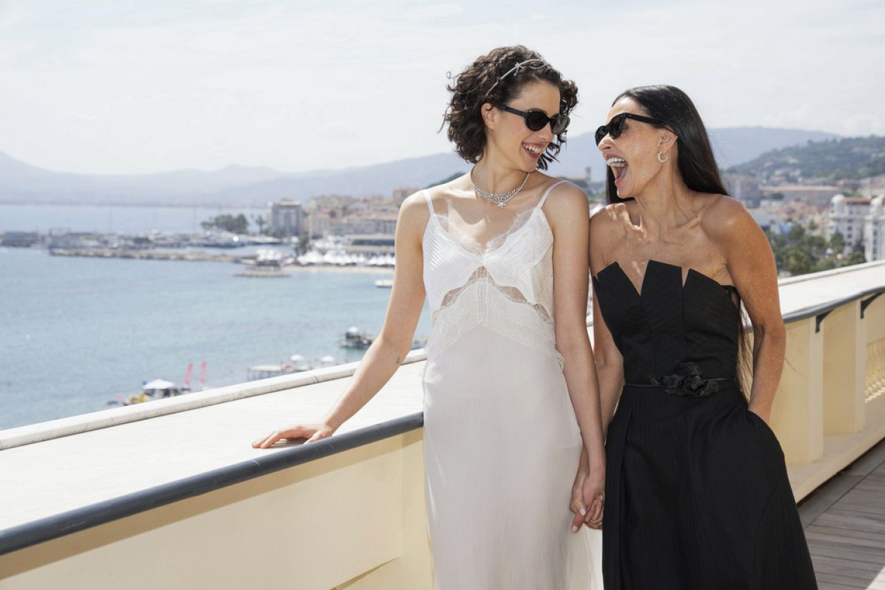 Margaret Qualley, left, and Demi Moore pose for photographers at the photo call for the film 'The Substance' at the 77th international film festival in Cannes