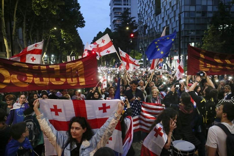 Demonstrators rally during an opposition protest against foreign influence bill and celebrating the Independence Day in Tbilisi, Georgia, Sunday, May 26, 2024.