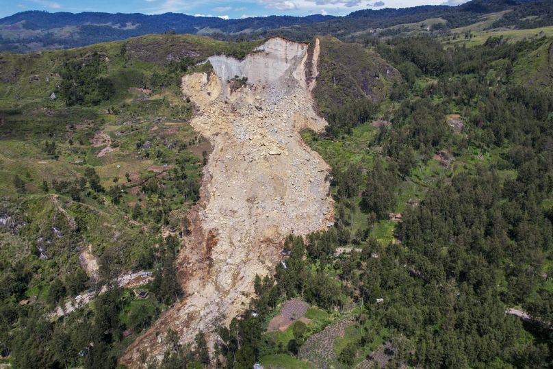 This photo released by UNDP Papua New Guinea, shows a landslide in Yambali village, in the Highlands of Papua New Guinea.