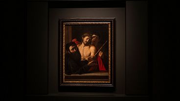 "Ecce Homo" (Latin for Behold The Man) by Michelangelo Merisi da Caravaggio is unveiled to the public for the first time in Spain's Prado Museum in Madrid on Monday, May 27
