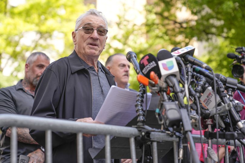 Robert De Niro speaks to reporters in support of President Joe Biden across the street from former President Donald Trump's criminal trial in New York.