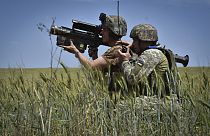 Ukrainian servicemen search a target with a US Stinger air defence missile launcher on the front line in Zaporizhzhia region, Ukraine, Tuesday, May 28, 2024