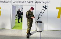 A soldier of the German Armed Forces Bundeswehr stands inside a new vaccination centre at the former Tempelhof airport in Berlin, Germany.