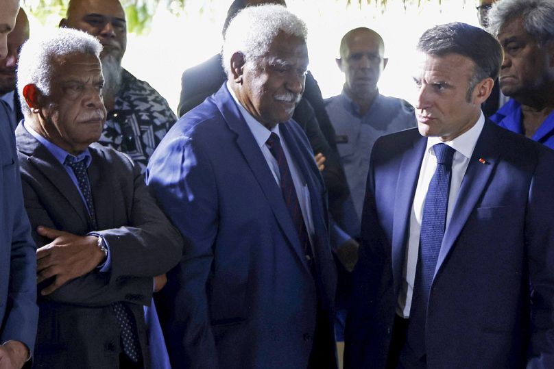 French President Emmanuel Macron (right) walks past New Caledonia&apos;s President Louis Mapou (left) in Noumea, New Caledonia, Thursday, May 23, 2024.